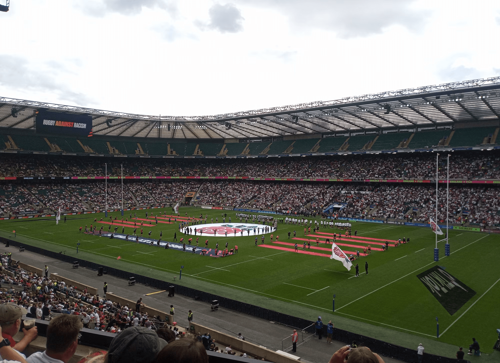 Rugby teams lining up at Twickenham Stadium before kickoff